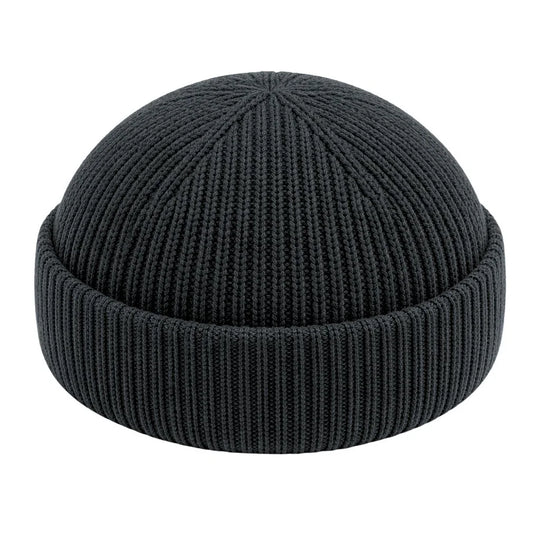 Unisex fisherman beanie cotton. Fade Black knit beanie on a white background