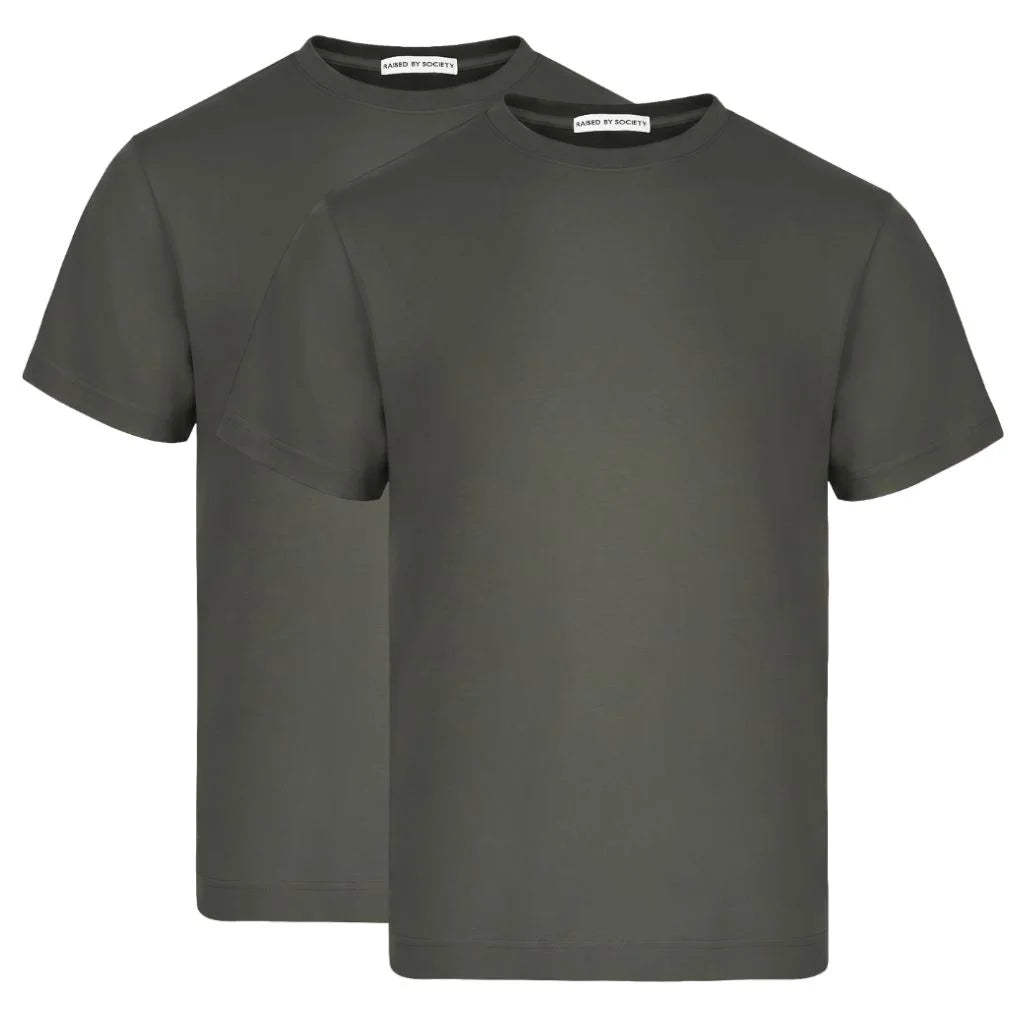 Loopwheeled t-shirt no side seams. Two green t-shirts with labels on a white background.